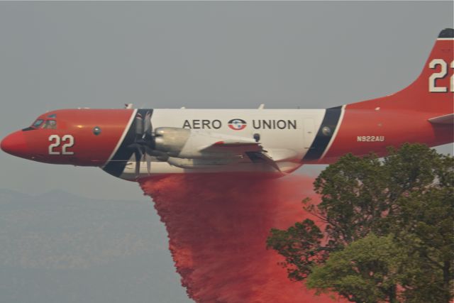 Fire fighting plane dropping retardant